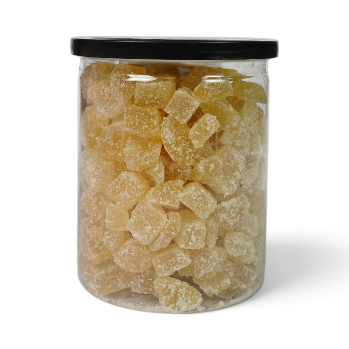 Mahnaz Food dried ginger cubes coated in sugar, packaged in a clear plastic jar with a black lid.