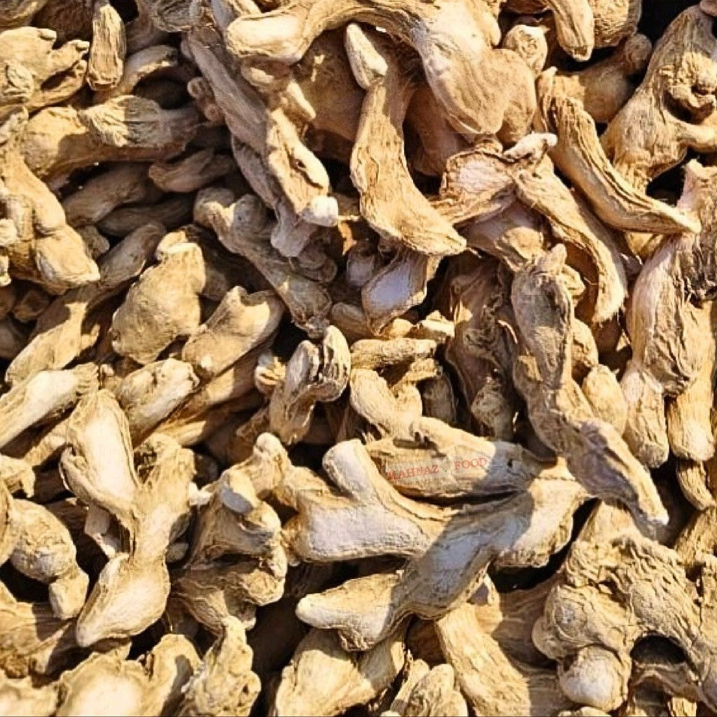 Mahnaz Food premium dried ginger pieces with a natural tan texture, ideal for cooking, baking, and spice blends.