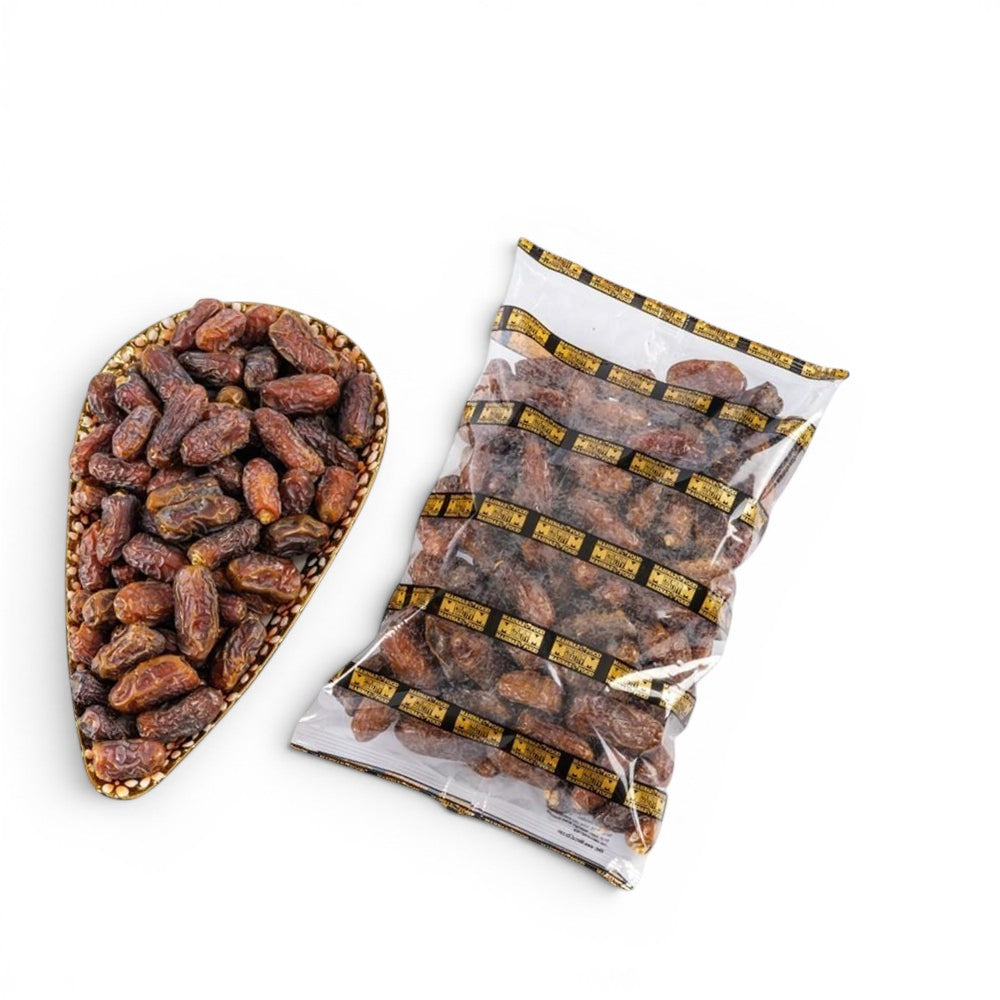 Mahnaz Food Mariami Dates in a decorative bowl and a clear plastic bag, showing golden to dark brown, chewy dates.