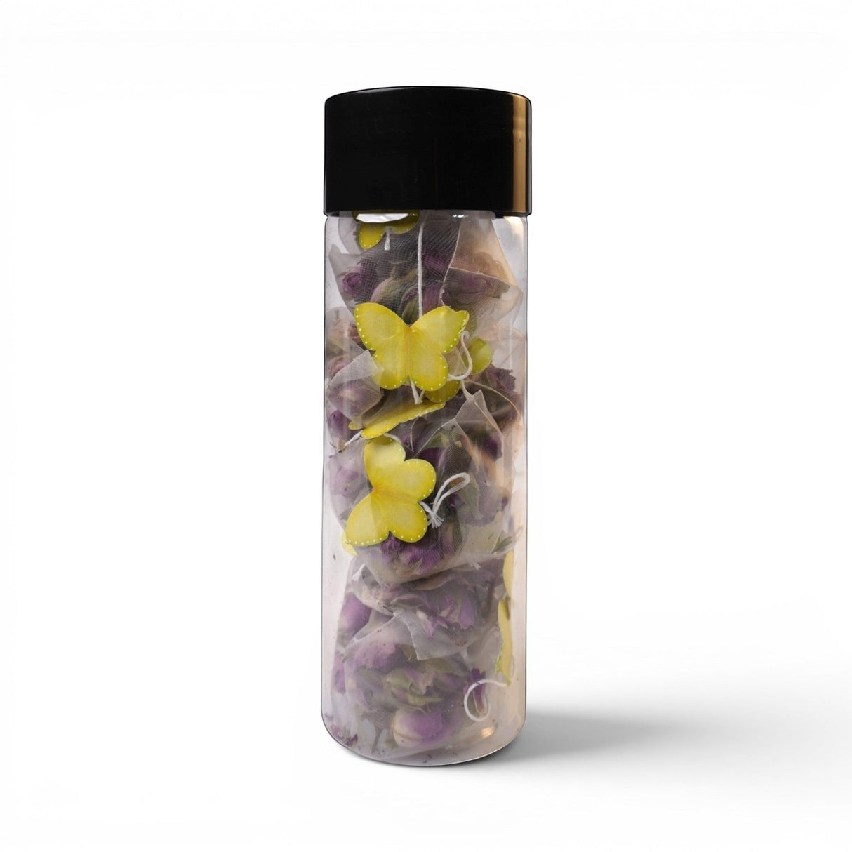 Mahnaz Food rose tea bags in a clear bottle with yellow butterfly decorations. Made from dried rose petals.