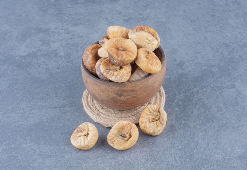 A small bowl filled with dried figs