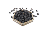 Mahnaz Food premium Ajwa AA dates in a decorative hexagonal tray, featuring deep black wrinkled skin.