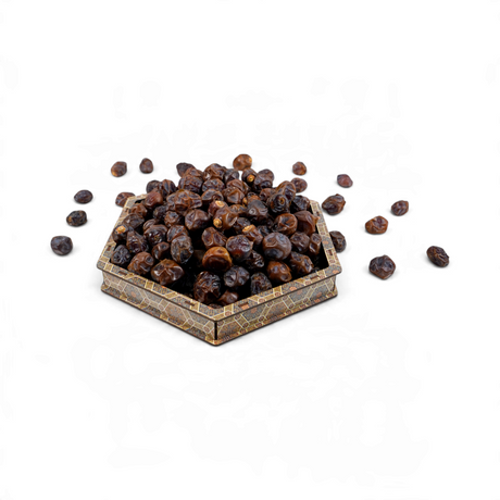 Mahnaz Food Gantar dates in a decorative hexagonal wooden bowl, featuring dark brown, chewy, naturally sweet fruit.