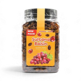 Mahnaz Food Sultana Raisins in a clear plastic jar with a yellow label featuring red grapes and product branding.