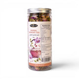 Mahnaz Food Herbal Memory Tea loose leaf blend with rose petals, saffron, and cardamom in a clear jar.