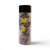 Mahnaz Food Rose Tea sachets with yellow butterfly decorations inside a clear bottle.