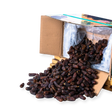 Mahnaz Food premium Mariami dates spilling from a wholesale cardboard box on a white background