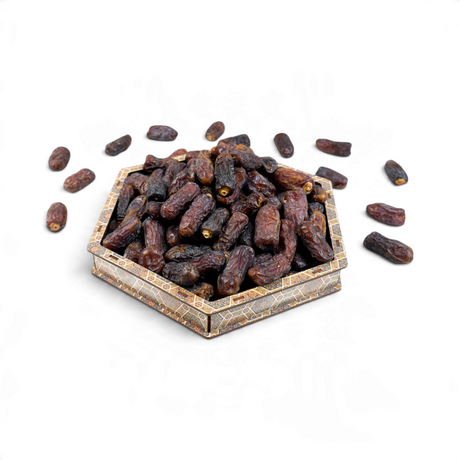 Mahnaz Food Mariami Jumbo dates in a decorative hexagonal wooden tray on a white background
