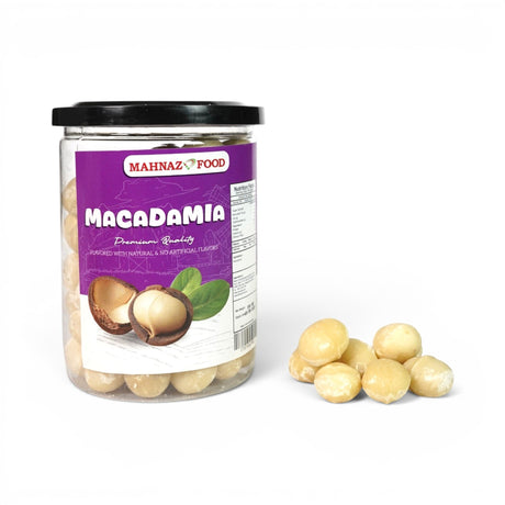 Mahnaz Food premium quality macadamia nuts in a clear plastic jar with a black lid and a small pile of nuts.