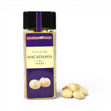 Mahnaz Food premium quality macadamia nuts in a clear plastic jar with a black lid, isolated on a white background.