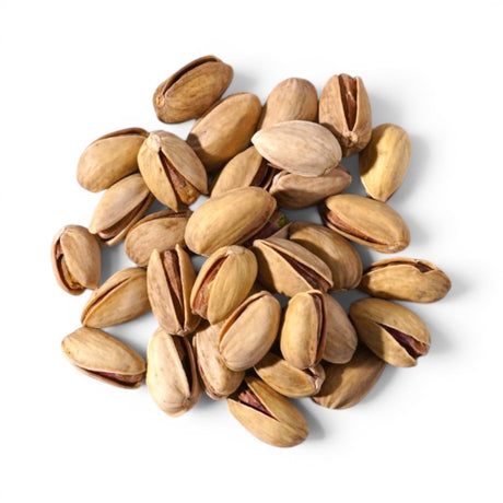 Mahnaz Food premium Iranian pistachios with light beige shells and vibrant green kernels in a pile