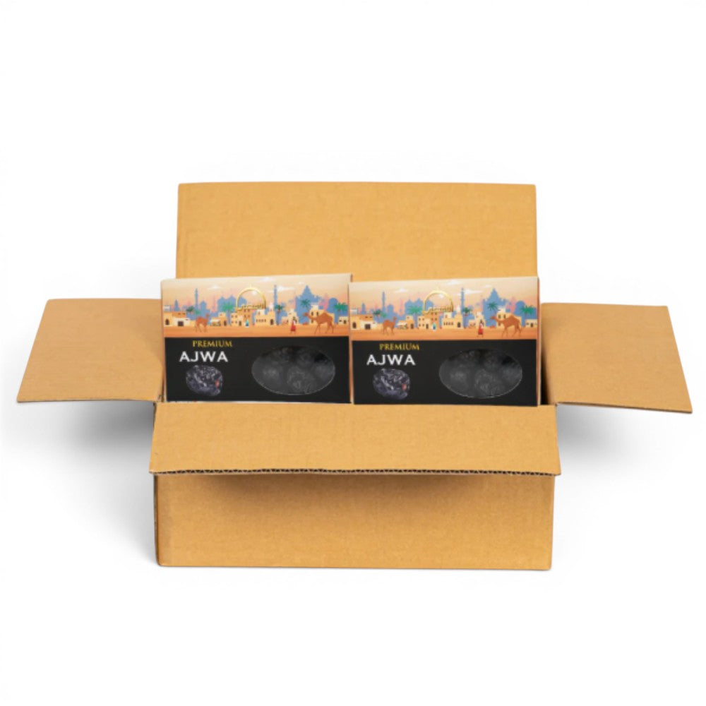 Mahnaz Food premium Ajwa dates in packaging inside a cardboard box, featuring Middle Eastern cityscape and camels.