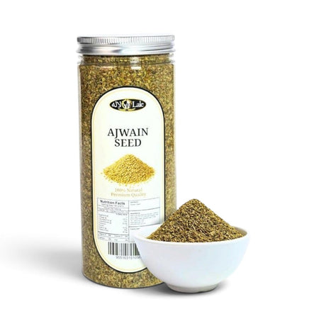 Mahnaz Food Ajwain seeds in a clear plastic jar with a small white bowl of seeds placed in front