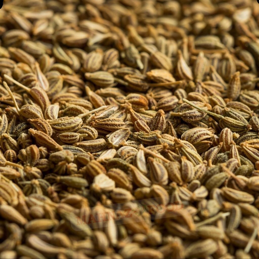 Close-up of premium Mahnaz Food Ajwain seeds with a textured, brownish-green appearance for cooking and baking.