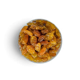 Mahnaz Food golden jumbo raisins in a glass bowl, a healthy dried fruit snack rich in fiber and natural energy.