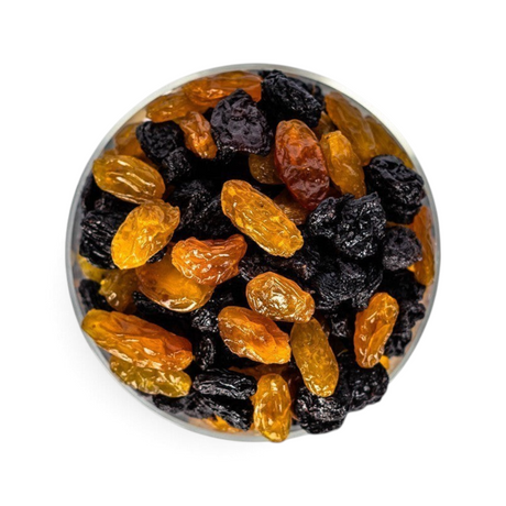 Mahnaz Food jumbo black and golden raisins mixed in a glass bowl, top-down view on a white background.