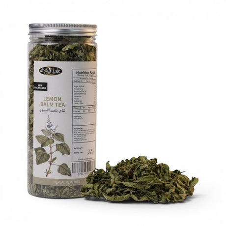 Mahnaz Food Lemon Balm Tea loose leaf herbal remedy in a clear jar with nutrition facts and a pile of dried leaves.