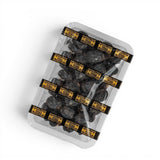 Mahnaz Food Madinah Ajwa dates, dark brown to black, wrinkled, soft dry fruit in a clear plastic tray.