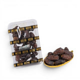 Mahnaz Food Mariami Dates, golden to dark brown, soft, sweet flesh, chewy texture, packed in plastic tray and small gold dish.