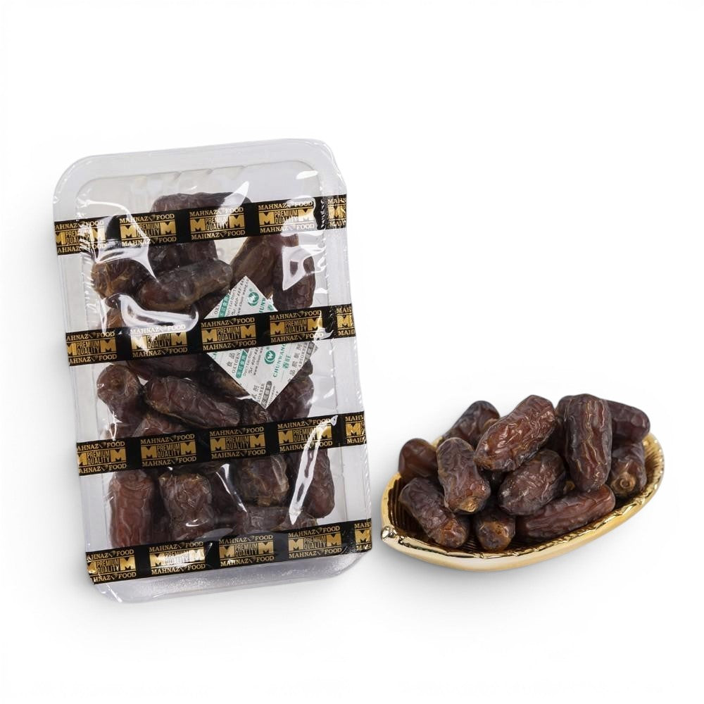 Mahnaz Food Mariami dates, golden to dark brown, with soft, sweet flesh and chewy texture, in packaging and a gold dish.