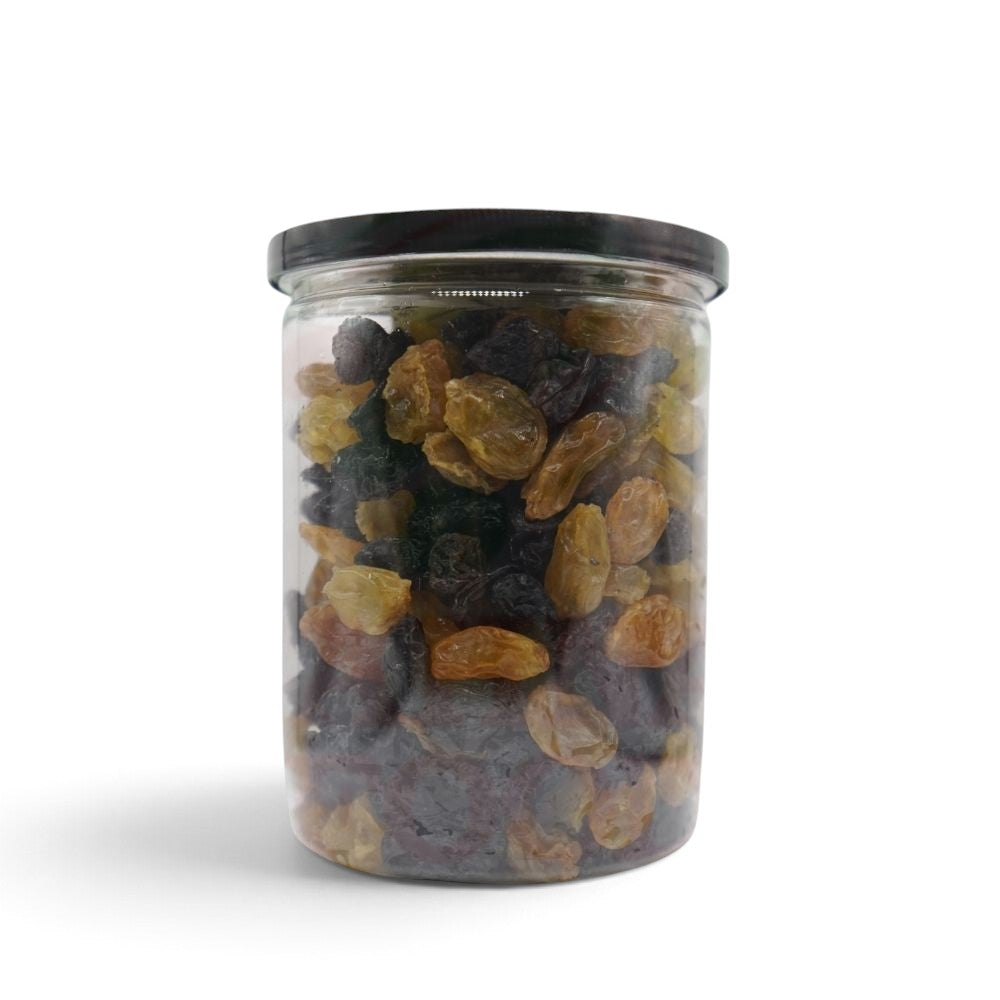 Mahnaz Food jumbo black and golden raisins mixed in a clear plastic jar for healthy snacking.