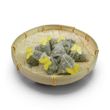 Mahnaz Food Moringa Herbal Tea Bags in a bamboo basket, featuring pyramid tea bags with yellow butterfly accents.