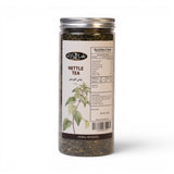 Mahnaz Food Nettle Tea in a clear jar with dried leaves, featuring a label with nutritional information and a botanical illustration of the nettle plant.
