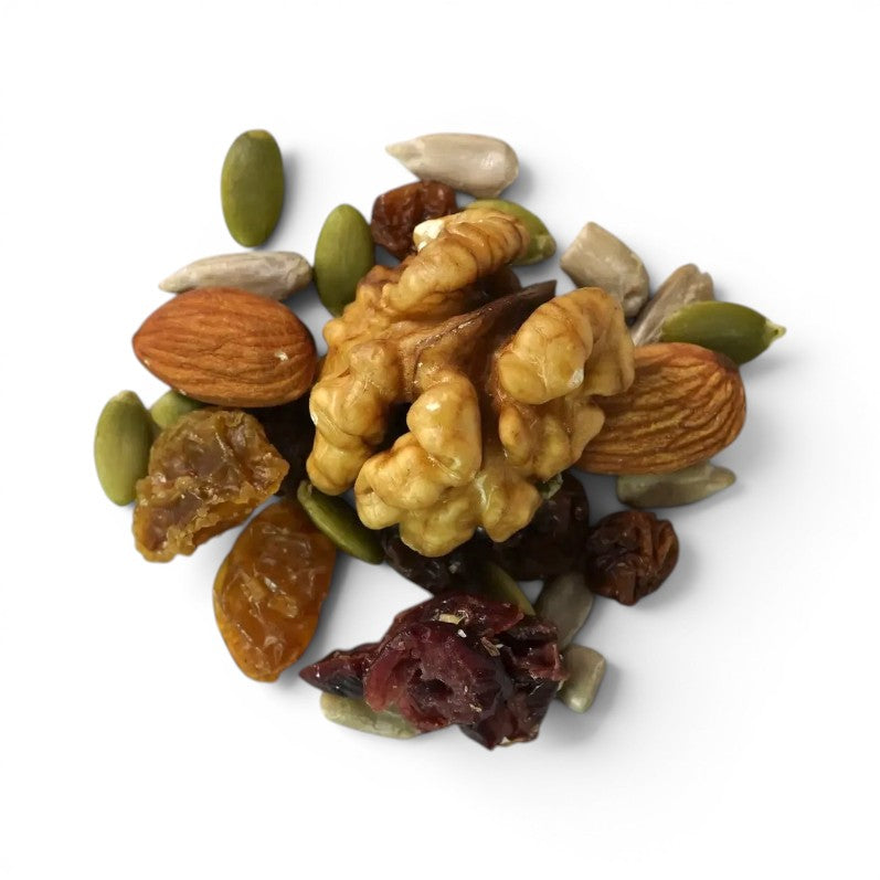 Mahnaz Food premium nut and berry mix featuring walnuts, almonds, pumpkin seeds, and dried fruit on a white surface