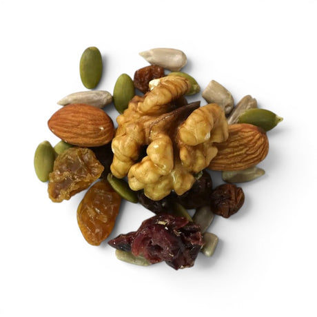 Mahnaz Food premium nut and berry mix featuring walnuts, almonds, pumpkin seeds, and dried fruit on a white surface