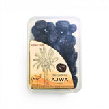 Mahnaz Food Premium Ajwa dates, dark brown, soft, wrinkled, in a clear plastic container.