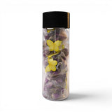 Mahnaz Food rose tea bags in a clear bottle with yellow butterfly decorations. Made from dried rose petals.