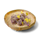 Mahnaz Food rose tea bags filled with dried rose petals, presented in a bamboo basket with yellow butterfly accents.