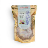 Mahnaz Food Royal Green Tea teabags in a golden pouch, featuring floral illustrations and text. Naturally caffeine-free.