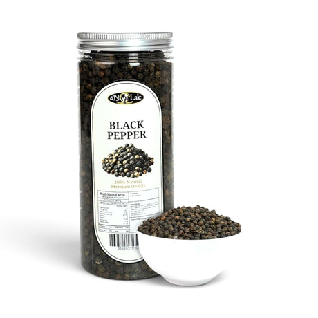 Mahnaz Food premium whole black peppercorns in a clear plastic jar next to a small white bowl filled with peppercorns
