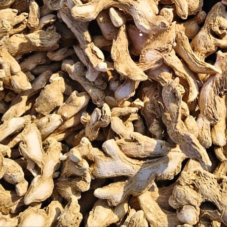 Mahnaz Food premium whole dried ginger roots with a textured, light brown surface for cooking and herbal tea.
