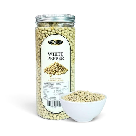 Mahnaz Food premium whole white peppercorns in a clear plastic jar with a small white bowl of pepper on the side