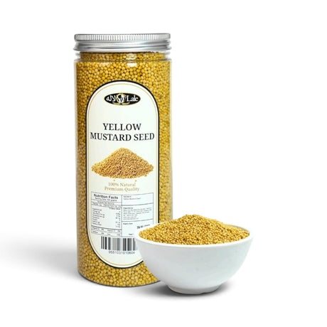 Mahnaz Food yellow mustard seeds in a clear plastic jar with a small white bowl of seeds in front